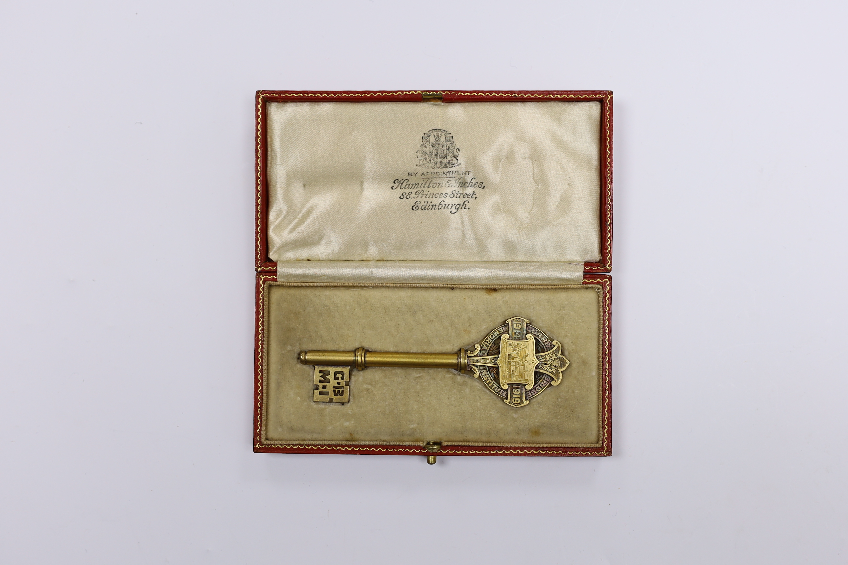 A cased gilt presentation key for the Guard Bridge Memorial Institute 1914 to 1919, presented by the architects, James Gillespie and Scott to W.D. Dixon, in fitted case, key 10.5cm